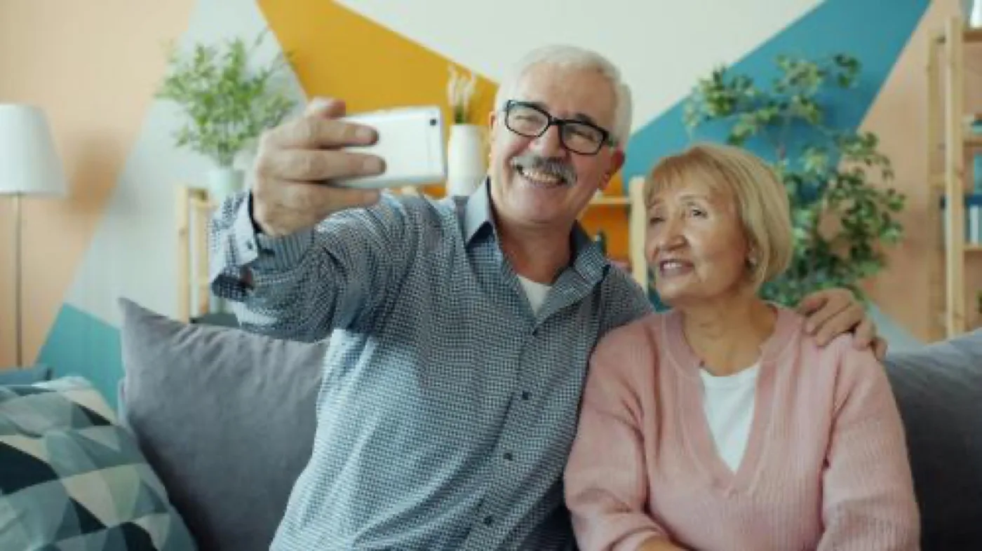 &ldquo;Retired couple reviewing financial plans at home, representing flexibility and using home equity to support retirement decisions.&rdquo;